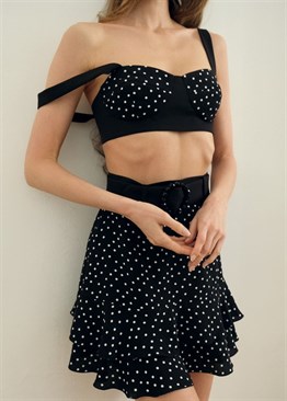 black skirt with white polka dots